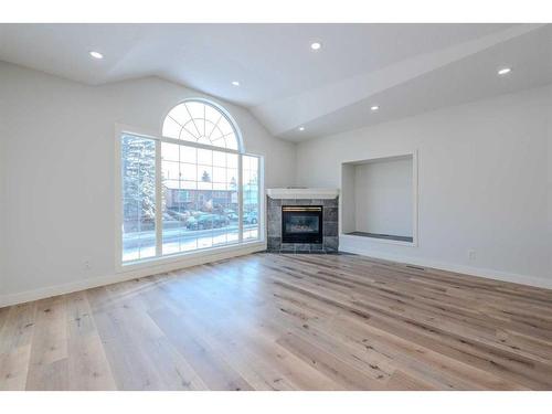 1435 42 Street Ne, Calgary, AB - Indoor Photo Showing Living Room With Fireplace