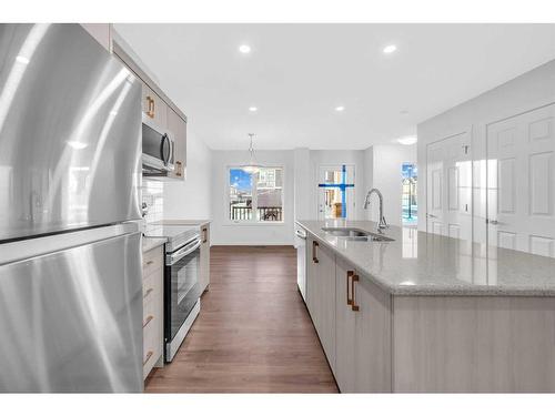 800 Windbury Street, Airdrie, AB - Indoor Photo Showing Kitchen With Double Sink With Upgraded Kitchen