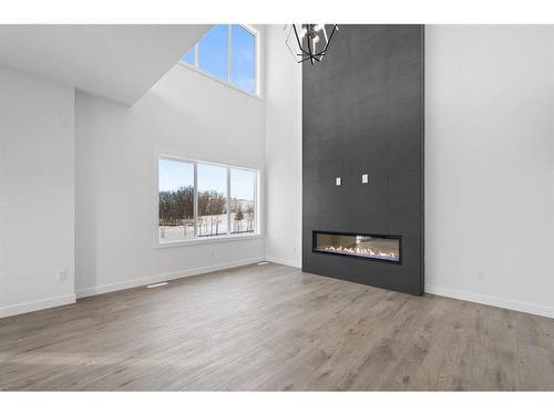 6 Crimson Ridge Cove Nw, Calgary, AB - Indoor Photo Showing Living Room With Fireplace