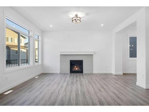 46 South Shore Bay, Chestermere, AB - Indoor Photo Showing Living Room With Fireplace