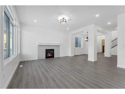 46 South Shore Bay, Chestermere, AB - Indoor Photo Showing Living Room With Fireplace