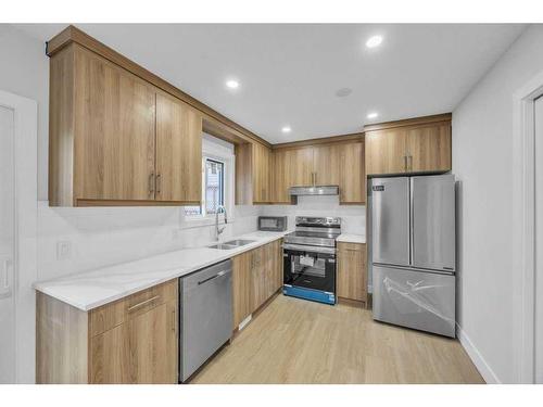 8 Martinglen Mews Ne, Calgary, AB - Indoor Photo Showing Kitchen With Stainless Steel Kitchen With Double Sink