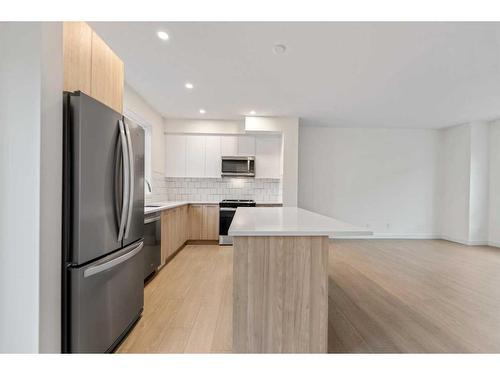 511-857 Belmont Drive Sw, Calgary, AB - Indoor Photo Showing Kitchen With Stainless Steel Kitchen With Upgraded Kitchen