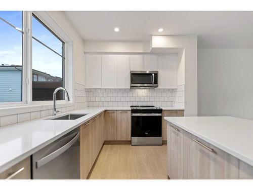 511-857 Belmont Drive Sw, Calgary, AB - Indoor Photo Showing Kitchen With Stainless Steel Kitchen With Upgraded Kitchen