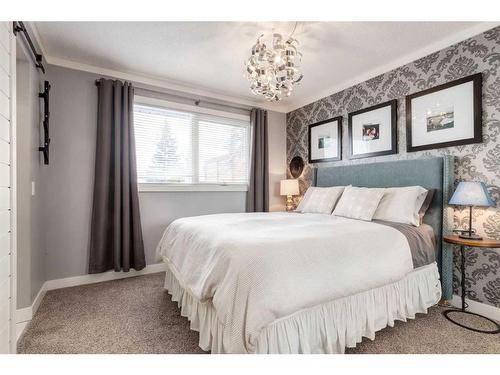 251 Queen Charlotte Way Se, Calgary, AB - Indoor Photo Showing Bedroom