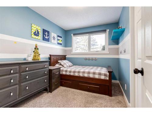 251 Queen Charlotte Way Se, Calgary, AB - Indoor Photo Showing Bedroom