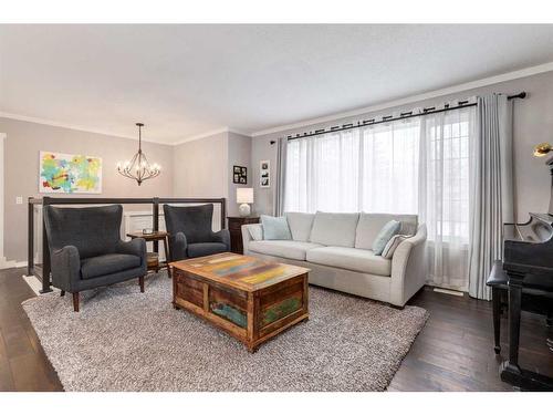 251 Queen Charlotte Way Se, Calgary, AB - Indoor Photo Showing Living Room