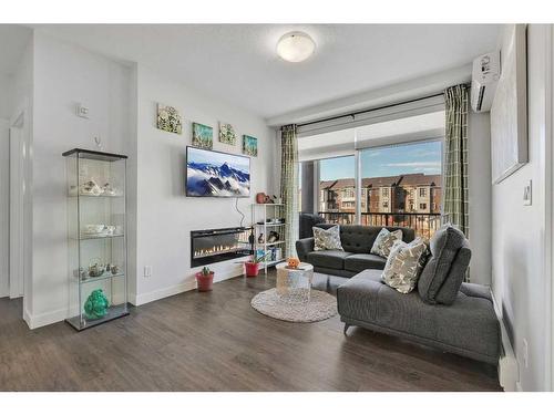 206-20 Walgrove Walk Se, Calgary, AB - Indoor Photo Showing Living Room With Fireplace