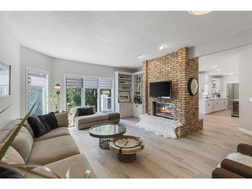 145 Candle Place Sw, Calgary, AB - Indoor Photo Showing Living Room With Fireplace