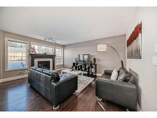 279 Springborough Way Sw, Calgary, AB - Indoor Photo Showing Living Room With Fireplace