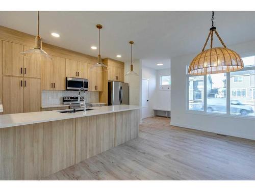 118 Clydesdale Avenue, Cochrane, AB - Indoor Photo Showing Kitchen With Upgraded Kitchen