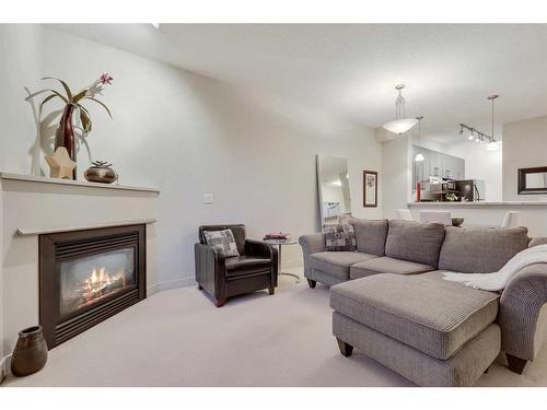 405-830 Centre Avenue Ne, Calgary, AB - Indoor Photo Showing Living Room With Fireplace