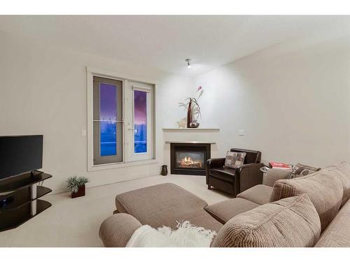 405-830 Centre Avenue Ne, Calgary, AB - Indoor Photo Showing Living Room With Fireplace