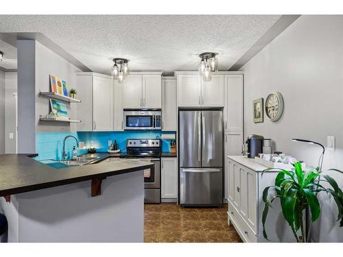 410-30 Discovery Ridge Close Sw, Calgary, AB - Indoor Photo Showing Kitchen With Stainless Steel Kitchen