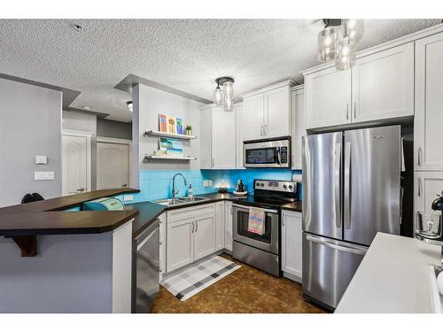 410-30 Discovery Ridge Close Sw, Calgary, AB - Indoor Photo Showing Kitchen With Stainless Steel Kitchen With Double Sink