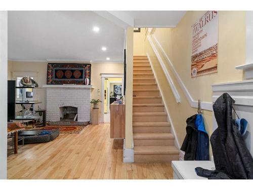 227 10A Street Nw, Calgary, AB - Indoor With Fireplace