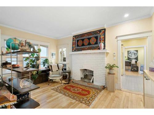 227 10A Street Nw, Calgary, AB - Indoor Photo Showing Living Room With Fireplace