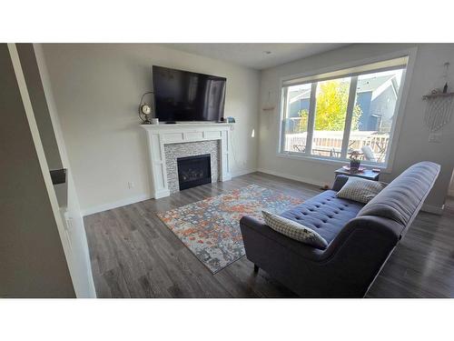 356 Bayview Way Sw, Airdrie, AB - Indoor Photo Showing Living Room With Fireplace