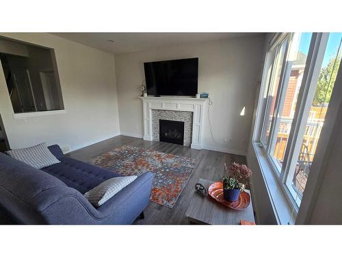 356 Bayview Way Sw, Airdrie, AB - Indoor Photo Showing Living Room With Fireplace