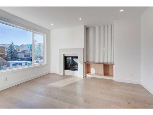 1603 16A Street Se, Calgary, AB - Indoor Photo Showing Living Room With Fireplace