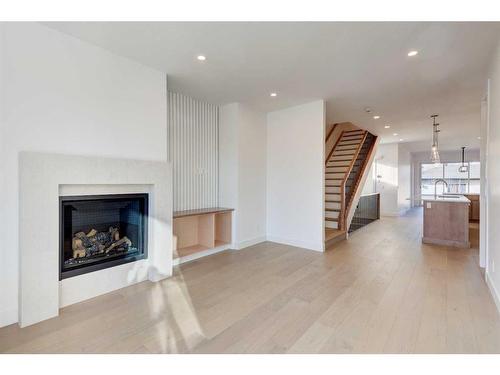 1603 16A Street Se, Calgary, AB - Indoor Photo Showing Living Room With Fireplace