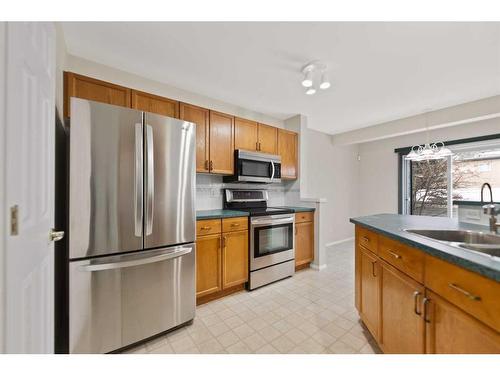 246 Bridelwood Court Sw, Calgary, AB - Indoor Photo Showing Kitchen