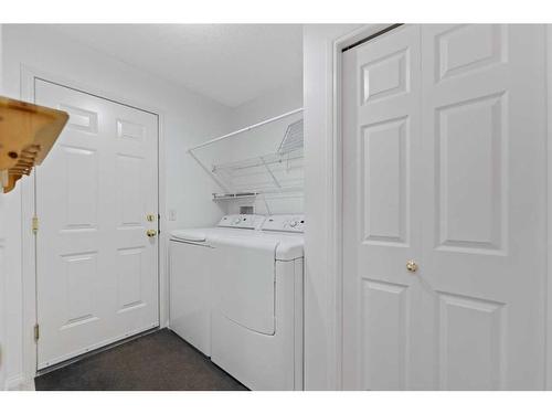 246 Bridelwood Court Sw, Calgary, AB - Indoor Photo Showing Laundry Room