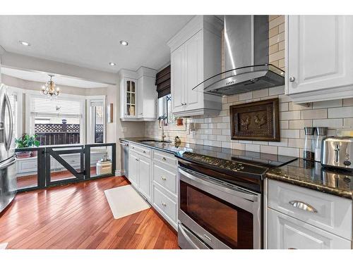 2 Edmund Way Se, Airdrie, AB - Indoor Photo Showing Kitchen With Upgraded Kitchen