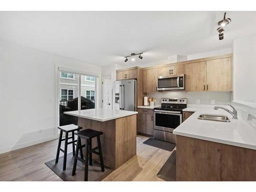 912 Cranbrook Walk Se, Calgary, AB - Indoor Photo Showing Kitchen With Stainless Steel Kitchen With Double Sink