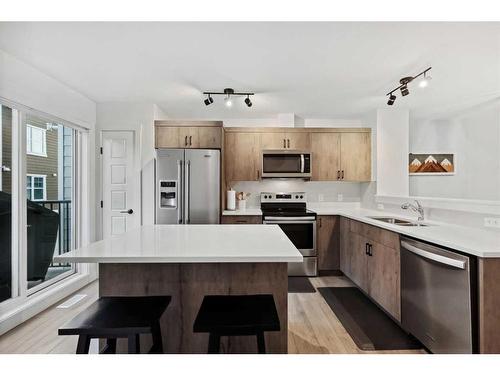 912 Cranbrook Walk Se, Calgary, AB - Indoor Photo Showing Kitchen With Stainless Steel Kitchen With Double Sink With Upgraded Kitchen