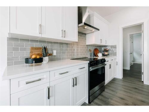 43 Saddlebred Place, Cochrane, AB - Indoor Photo Showing Kitchen With Upgraded Kitchen