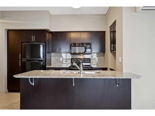 1319-8880 Horton Road Sw, Calgary, AB - Indoor Photo Showing Kitchen With Upgraded Kitchen