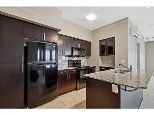 1319-8880 Horton Road Sw, Calgary, AB - Indoor Photo Showing Kitchen With Double Sink With Upgraded Kitchen