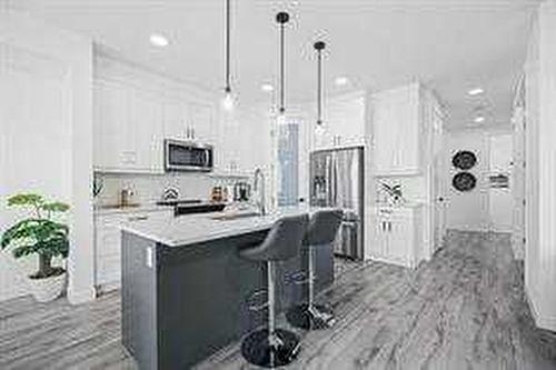 1033 Iron Landing Way, Crossfield, AB - Indoor Photo Showing Kitchen With Upgraded Kitchen