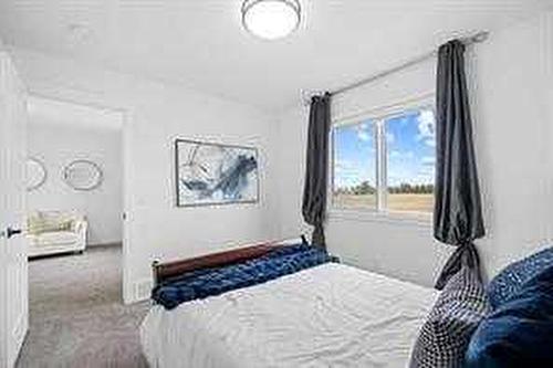 1033 Iron Landing Way, Crossfield, AB - Indoor Photo Showing Bedroom