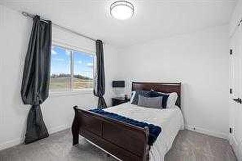 1033 Iron Landing Way, Crossfield, AB - Indoor Photo Showing Bedroom