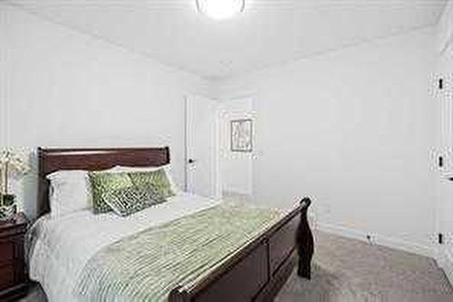 1033 Iron Landing Way, Crossfield, AB - Indoor Photo Showing Bedroom