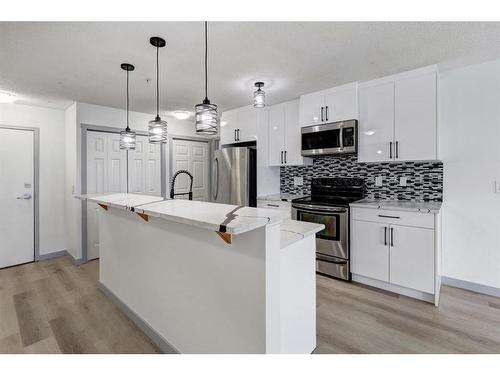 2217-700 Willowbrook Road Nw, Airdrie, AB - Indoor Photo Showing Kitchen With Upgraded Kitchen