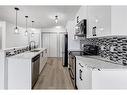 2217-700 Willowbrook Road Nw, Airdrie, AB  - Indoor Photo Showing Kitchen With Stainless Steel Kitchen With Double Sink With Upgraded Kitchen 