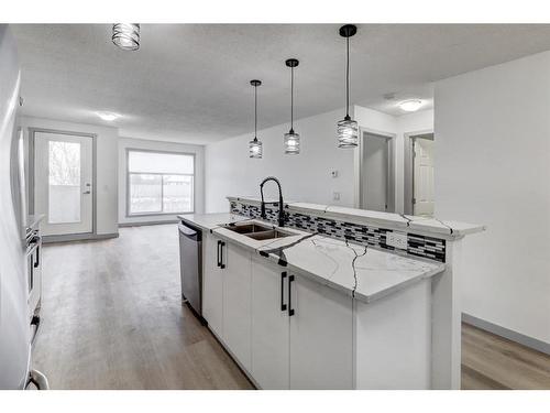 2217-700 Willowbrook Road Nw, Airdrie, AB - Indoor Photo Showing Kitchen With Double Sink