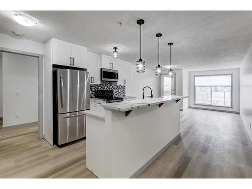 2217-700 Willowbrook Road Nw, Airdrie, AB - Indoor Photo Showing Kitchen With Stainless Steel Kitchen With Upgraded Kitchen