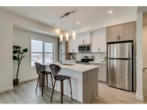 88-2117 81 Street Sw, Calgary, AB - Indoor Photo Showing Kitchen With Stainless Steel Kitchen With Upgraded Kitchen