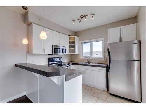 403-1108 15 Street Sw, Calgary, AB - Indoor Photo Showing Kitchen With Double Sink