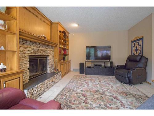 319 Edenwold Drive Nw, Calgary, AB - Indoor Photo Showing Living Room With Fireplace