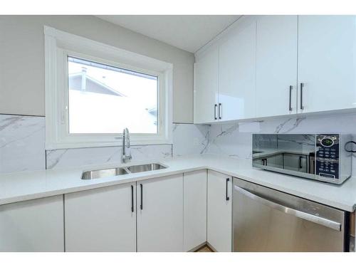 23 Martinwood Court Ne, Calgary, AB - Indoor Photo Showing Kitchen With Double Sink