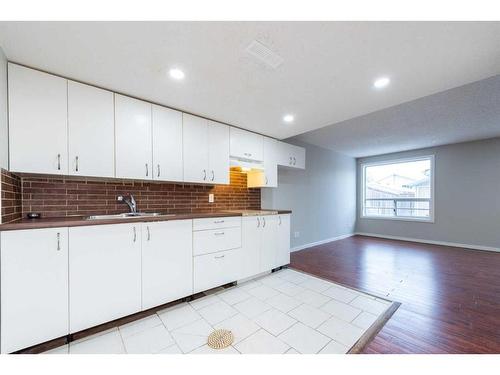 23 Martinwood Court Ne, Calgary, AB - Indoor Photo Showing Kitchen With Double Sink