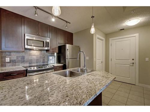 308-108 25 Avenue Sw, Calgary, AB - Indoor Photo Showing Kitchen With Stainless Steel Kitchen With Double Sink With Upgraded Kitchen