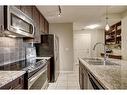 308-108 25 Avenue Sw, Calgary, AB  - Indoor Photo Showing Kitchen With Double Sink 