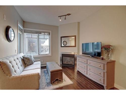 308-108 25 Avenue Sw, Calgary, AB - Indoor Photo Showing Living Room With Fireplace