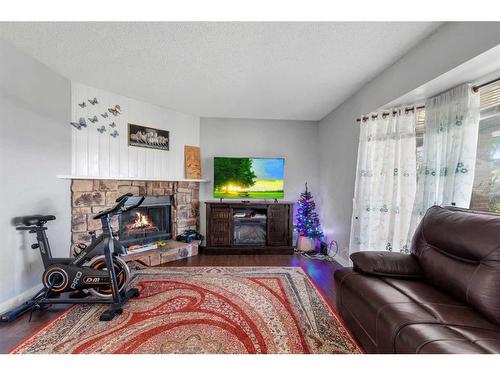 87 Edgehill Drive, Calgary, AB - Indoor Photo Showing Living Room With Fireplace